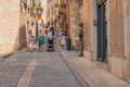 Old street with people in the historic quarter of the antique Spanish village Montblanc.