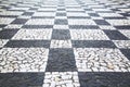 Old street road paved surface stone pavement walkway texture pattern Chess board. Royalty Free Stock Photo