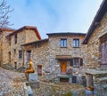 The old street and the sculpture by Marco Prati, on March 16 in Bre, Switzerland Royalty Free Stock Photo