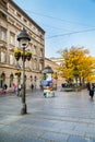 The old street Skadarlija in Belgrade, Serbia, people, yellow autumn trees