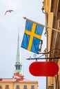 Swedish flag and blank shop sign in Stockholm Royalty Free Stock Photo