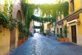 Old street in Trastevere, Rome, Italy. Cozy old street in Trastevere neighborhood of Rome, typical architecture and landmark of Royalty Free Stock Photo