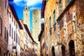 Traditional Italy - old narrow streets of medieval San Gimignano village. Royalty Free Stock Photo