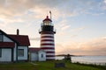 Old Striped Lighthouse Tower Sines Brightly in Maine Royalty Free Stock Photo