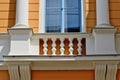 old stucco exterior elevation detail. wood window and decorative white balustrade detail