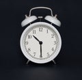 Old-style alarm clock, black and white, it`s half past ten. Royalty Free Stock Photo