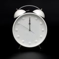 Old-style alarm clock, black and white, it`s twelve oclock