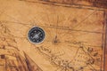 Old style brass compass on map Royalty Free Stock Photo