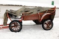 Old style cart under snowfall
