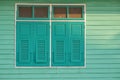 Old style closed window in green White colour s painting and exterior design with sunlight