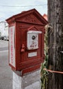 Old style emergency box seen installed on a busy side street.
