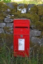 Old style English letter box set into a dry stone wall in north Yorkshire