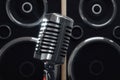 Old style microphone at speakers background Royalty Free Stock Photo