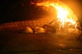 Old style middle east stone oven with flat bread with different spices inside