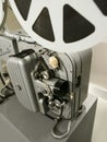 Old style movie projector, still-life, close-up. vintage, old-fashioned film projector, blurred background Royalty Free Stock Photo