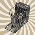 Old style photo camera on retro background