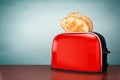 Old Style Photo. Toast popping out of Vintage Red Toaster Royalty Free Stock Photo