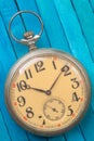 Old style pocket watch on wooden backround Royalty Free Stock Photo