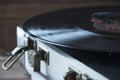 Old style record player of vinyl disc with needle and plate, home cozy evening mood Royalty Free Stock Photo