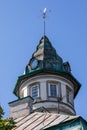 Old style roof tower with wind indicator.