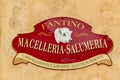 Old Italian style sign with the words `Butcher`s shop delicatessen`