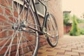 Old style singlespeed bicycle against brick wall Royalty Free Stock Photo