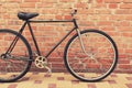 Old style singlespeed bicycle against brick wall Royalty Free Stock Photo