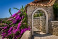 Old style stone gate at sunny summer day