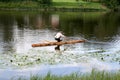 Old style travailing on the river on a log Royalty Free Stock Photo