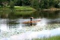 Old style travailing on the river on a log Royalty Free Stock Photo