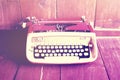 Old style typewriter on wooden floor Royalty Free Stock Photo