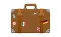 Old style vintage brown voyage suitcase with travel stickers hand drawn cartoon style. Vector illustration. Royalty Free Stock Photo