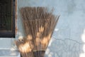 Old styled broom made of coconut leaf and dry leaf Royalty Free Stock Photo