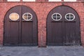 Old stylish door in building of fire brigade. Royalty Free Stock Photo