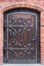 Old stylish door in Polish cathedlak Royalty Free Stock Photo