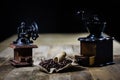 Old stylish grinder for grinding tasty coffee on an old wooden t