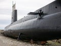 An old submarine exposed out of the water