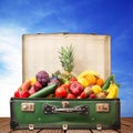 Suitcase full of fruit and vegetables Royalty Free Stock Photo