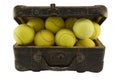 Old suitcase full of tennis balls