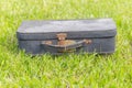 Old suitcase on grass Royalty Free Stock Photo