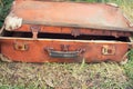 Old suitcase in the grass Royalty Free Stock Photo