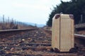 Old suitcase at the train station with retro effect Royalty Free Stock Photo