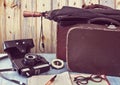 Old suitcases and a camera. Set traveler. Royalty Free Stock Photo