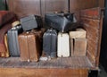 Old suitcases on an old wooden cart