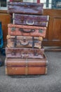 Old suitcases stacked on trolleys in a station Royalty Free Stock Photo