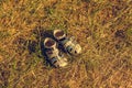 Summer children shoes standing on a summer grass Royalty Free Stock Photo