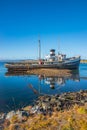 Old sunken boat in the harbor in Ushuaia, Patagonia, Argentina