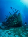 A scuba diver exploring a sunken wreck on the Aegean Sea in Greece Royalty Free Stock Photo