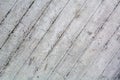 An old surface of concrete with impressions of rough boards. Gray industrial background. Royalty Free Stock Photo