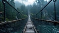 Old suspension bridge in misty forest, vintage hanging wood path over river in dark foggy woods. Concept of travel, journey,